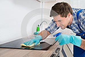 Janitor Cleaning Induction Stove photo
