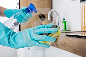 Janitor Cleaning Kitchen Worktop