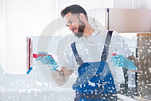 Janitor Cleaning Window With Squeegee