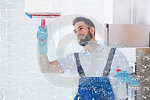 Janitor Cleaning Window With Squeegee