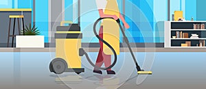 Janitor holding professional vacuum cleaner character in uniform cleaning service floor care concept modern co-working