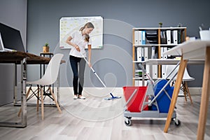 Janitor Mopping Floor In Office