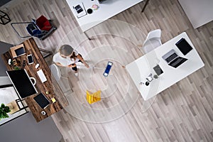 Janitor Mopping Floor In Office