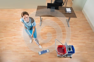 Janitor Mopping Floor In Office