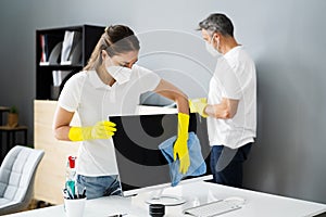 Janitor Service Woman Cleaning Monitor On Desk