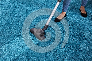 Janitor Using Vacuum Cleaner For Cleaning Carpet