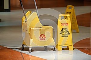 Janitorial Mop and Caution Sign