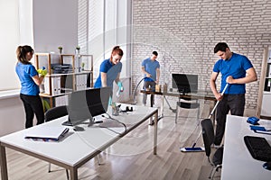 Janitors Cleaning The Office