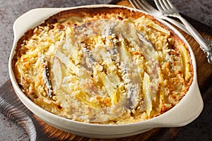 Jansson\'s frestelse or Janssons temptation is a Swedish gratin style dish made from potatoes, onion and sprats