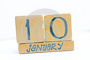 January 10th. Day 10 of month, calendar on wooden background. Winter time, year concept