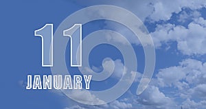 january 11. 11-th day of the month, calendar date.White numbers against a blue sky with clouds. Copy space, winter month