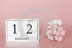 January 12th. Day 12 of month. Calendar cube on modern pink background, concept of bussines and an importent event