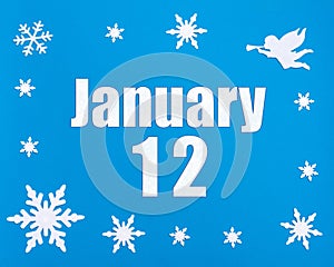 January 12th. Winter blue background with snowflakes, angel and a calendar date. Day 12 of month.