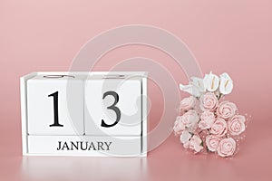 January 13th. Day 13 of month. Calendar cube on modern pink background, concept of bussines and an importent event