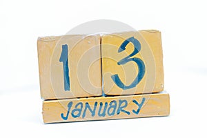January 13th. Day 13 of month, calendar on wooden background. Winter time, year concept