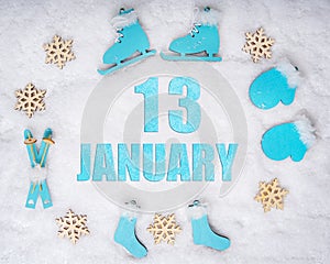 January 13th. Sports set with blue wooden skates, skis, sledges and snowflakes and a calendar date. Day 13 of month.