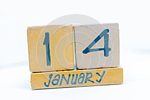 January 14th. Day 14 of month, calendar on wooden background. Winter time, year concept