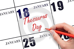 January 18. Hand writing text Thesaurus Day on calendar date. Save the date.