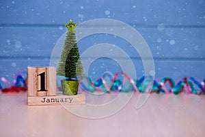 January 1st. Day 1 of January set on wooden calendar on blue wooden plank background