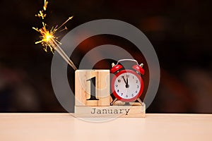 January 1st. Day 1 of January set on wooden calendar with dark background. Winter time