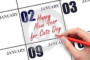 January 2. Hand writing text Happy Mew Year for Cats Day on calendar date. Save the date.