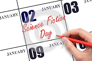 January 2. Hand writing text Science Fiction Day on calendar date. Save the date.