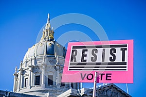 January 20, 2018 San Francisco / CA / USA - Resist Vote sign raised at the Women's March rally which took place in the Civic