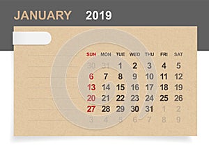 January 2019 - Monthly calendar on brown paper and wood background.