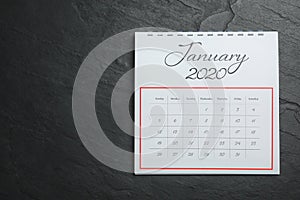 January 2020 calendar on black stone background. Space for text