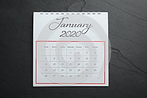 January 2020 calendar on black stone, top view