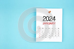 January 2024 calendar page with push pin on blue background