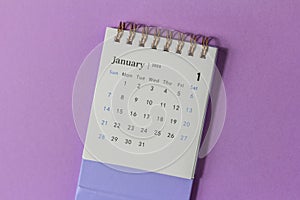 January 2024. Desk calendar for 2024 on a lilac background with copy space