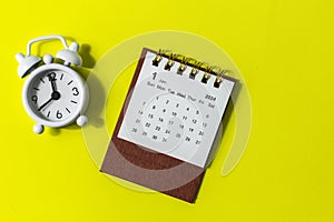 January 2024. Desk calendar for 2024 on a yellow background with copy space.