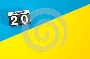 January 20th. Day 20 of january month, calendar on blue and yellow background flat lay, top view. Winter time. Empty