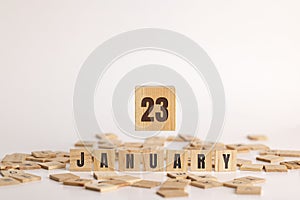 January 23 displayed on wooden letter blocks on white background