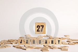 January 27 displayed on wooden letter blocks on white background