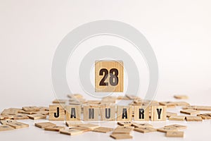 January 28 displayed on wooden letter blocks on white background