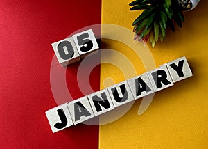 January 5  on wooden cubes on a yellow-red background .