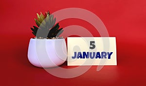 January 5 on a yellow sticker. Next to it is a pot with a flower on a red background