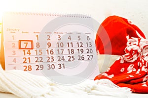 January 7th. Day 7 of month on white calendar. Concept of Merry