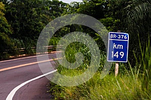 January 3, 2016, Brazil. Indicative plate in the middle of the bush in Mato Grosso do Sul. Dangerous curve ahead