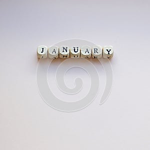 January on a cream background