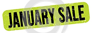 JANUARY SALE text on green-black grungy stamp sign