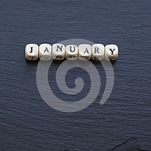 January on a slate background