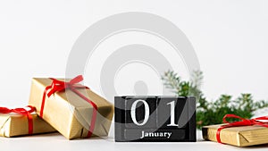 January 1st. Day 1 of january month, calendar with gift boxes and fir branches on white background. Winter time. Happy New year