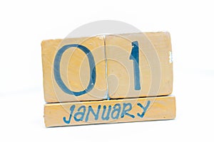 January 1st. Day 1 of month, calendar on wooden background. Winter time, New year concept