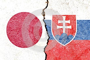 Jap vs Slovakia flags on cracked wall