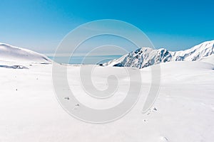 The japan alps Tateyama Kurobe alpine in sunshine day with blue sky background is one of the most important and popular natural