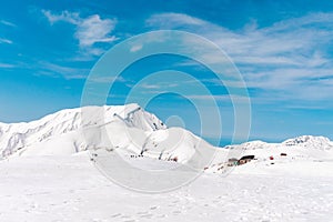 The japan alps Tateyama Kurobe alpine in sunshine day with blue sky background is one of the most important and popular natural