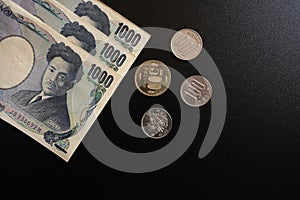 Japan currency paper banknote and coins on dark background, banking economic and finance concept, Japanese money investment ,